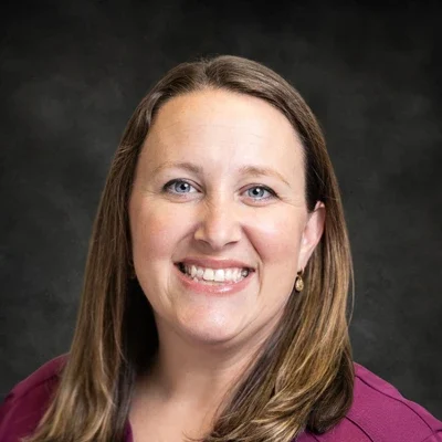 A headshot photo of Ashley