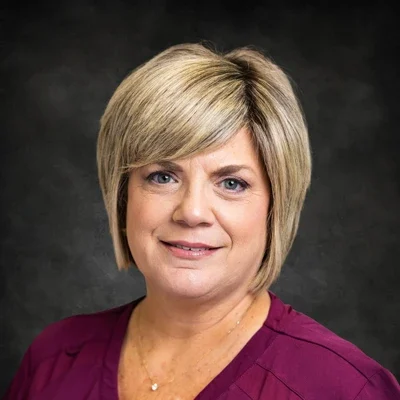 A headshot photo of Nicole